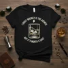 Black t-shirt with text "I DOUIT WHISKEY IS THE ANSWER. BUT IT'S WORTH A SHOT." and a graphic of a