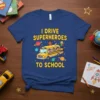 I Drive Superheroes To School text with a cartoon school bus carrying kids and planets graphic on a navy blue
