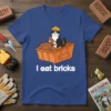 T-shirt with white text "I eat bricks" and a cartoon cat in a hard hat sitting in a dumpster of
