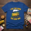 I Eat The Corn The Long Way t-shirt design featuring a corn cob train with smoke and railway tracks