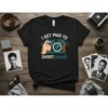 Black t-shirt with "I GET PAID TO SHOOT people" text and a vintage camera graphic, perfect for photographers