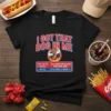 Black t-shirt with "I Got That Dog In Me" text and a muscular hot dog graphic, listing calorie information for