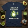 T-shirt with "I Had A Pit In My Stomach When We First Met" text and a cartoon avocado holding a
