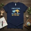 Navy blue t-shirt with the quote "I HAD A PLAN, BUT GOD HAD A BETTER ONE" in yellow and blue