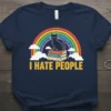 I Hate People T-Shirt with a black cat sitting on books under a rainbow, featuring yellow text