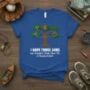 I HAVE THREE SONS and Wouldn't Trade Them For A Hundred Girls quote on a blue t-shirt with a tree