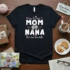 T-shirt with text "I Have Two Titles MOM NANA and I Rock Them Both" in white and pink typography, featuring