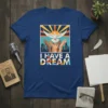 I Have A Dream quote t-shirt with a white dove, raised hands, and cityscape graphic