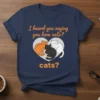 T-shirt with text "I heard you saying you love cats? cats?" featuring three cartoon cats in a heart shape, navy