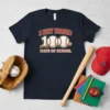 T-shirt with text "I HIT HARD 100 DAYS OF SCHOOL" and baseball graphics, navy blue tee