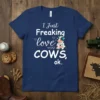 Navy blue t-shirt with white text "I Just Freaking love COWS, ok." and a cartoon cow drinking a milkshake