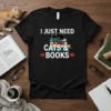 I Just Need Cats & Books quote on black t-shirt with illustration of a sleeping cat on books and red