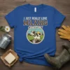 Blue t-shirt with "I Just Really Love Milking Cows, OK!" text and a cartoon cow on a farm