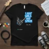 Black t-shirt with "I Just Smile And Strum" text and a white electric guitar graphic