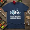 I Just Wanna Kiss My Fish text with cartoon angler fish design on a navy t-shirt, perfect for fishing lovers