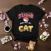 Black t-shirt with "I Just Want to Eat Sushi And Pet My Cat" text and sushi graphic
