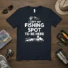 I Left My Fishing Spot To Be Here quote on a navy t-shirt, featuring a jumping bass and city skyline