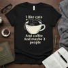 Black t-shirt with the text "I like cats And coffee And maybe 3 people" and a graphic of a cat