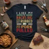 I Like My Racks Big My Butt Rubbed And My Pork Pulled quote on a dark t-shirt, featuring barbecue-themed text