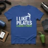 I Like Pilates & Maybe 3 People humorous quote on a blue t-shirt with a pilates silhouette graphic