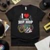 Black t-shirt with "I LOVE HIP HOP" text, red heart, gold chain, and sneakers design, representing hip hop culture