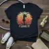 Retro sunset design with a silhouette of a woman hula hooping and the text "I Love It" surrounded by flowers