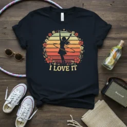 Retro sunset design with a silhouette of a woman hula hooping and the text "I Love It" surrounded by flowers