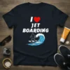 I Love Jet Boarding t-shirt design with a person riding a hydrofoil on a wave. Includes white text and a