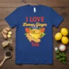 I LOVE Lemon Ginger Tea graphic t-shirt featuring a yellow teacup with steam, lemon slice, ginger root, and red floral