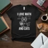 I Love Math And Cats T-Shirt featuring a cartoon cat holding a calculator with math equations around it