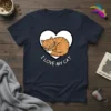 I LOVE MY CAT text with a sleeping orange tabby cat inside a white heart graphic on a navy t-shirt