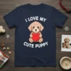 I Love My Cute Puppy text with a cartoon dog holding a red heart on a navy t-shirt