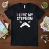 I Love My Stepmom text with floral accent and fist bump graphic on a black t-shirt