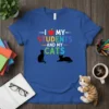 I Love My Students And My Cats t-shirt with colorful text, an apple icon, and two black cat silhouettes