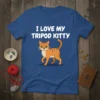 I Love My Tripod Kitty text with illustration of an orange tabby cat with three legs on a blue t-shirt