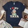 I Love My Yaya graphic t-shirt design with a cute illustration of a grandmother holding a rolling pin