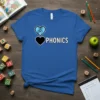 Blue t-shirt with "I love phonics" design featuring a peace sign heart and black heart