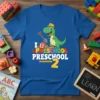 I Love Preschool Preschool 2 text with a cartoon dinosaur holding a shovel, on a blue t-shirt