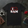 I love SAM text with a red heart graphic on a black t-shirt design