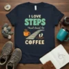 I LOVE STEPS That lead to COFFEE text design with stairs and coffee cup graphic on a navy t-shirt
