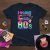 I Love The 80s graphic t-shirt with retro arcade game, boombox, electric guitar, and colorful font