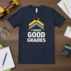 Navy blue t-shirt with "I MAKE GOOD GRADES" text and graduation cap graphic