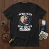 Black t-shirt with white text "I May Be In The USA But My Heart Is In Morocco" and a globe