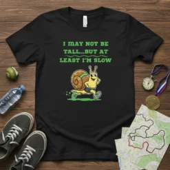 T-shirt with green text "I May Not Be Tall...But At Least I'm Slow" and a cartoon snail running, black shirt