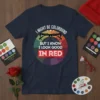 I Might Be Colorblind But I Know I Look Good In Red quote t-shirt with glasses graphic and color wheel
