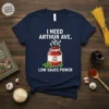T-shirt with "I Need Arthur Ave. Low Sauce Power" text and a jar of sauce graphic, navy blue shirt