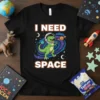I Need Space text with astronaut T-Rex in outer space graphic on black t-shirt
