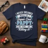 Navy t-shirt with "I NEVER DREAMED I WOULD BE A Super Cool PAPPY BUT HERE I AM Killing it!" quote