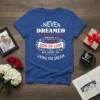 Blue t-shirt with white and red text "I NEVER DREAMED I'D END UP BEING A AWESOME SON-IN-LAW BUT HERE I
