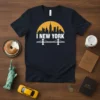 Navy blue t-shirt with white "I New York" text, a yellow sun silhouette, and a bridge graphic representing the NYC